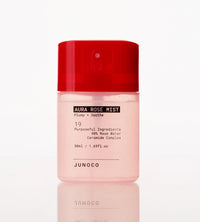 Pink bottle of Junoco Aura Rose Mist with red cap on a white background
